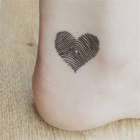 heart finger print tattoo